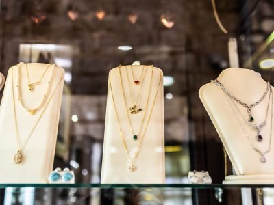 Elegant jewelry display with gemstones and necklaces. Luxury design, fashion accessories, and retail presentation